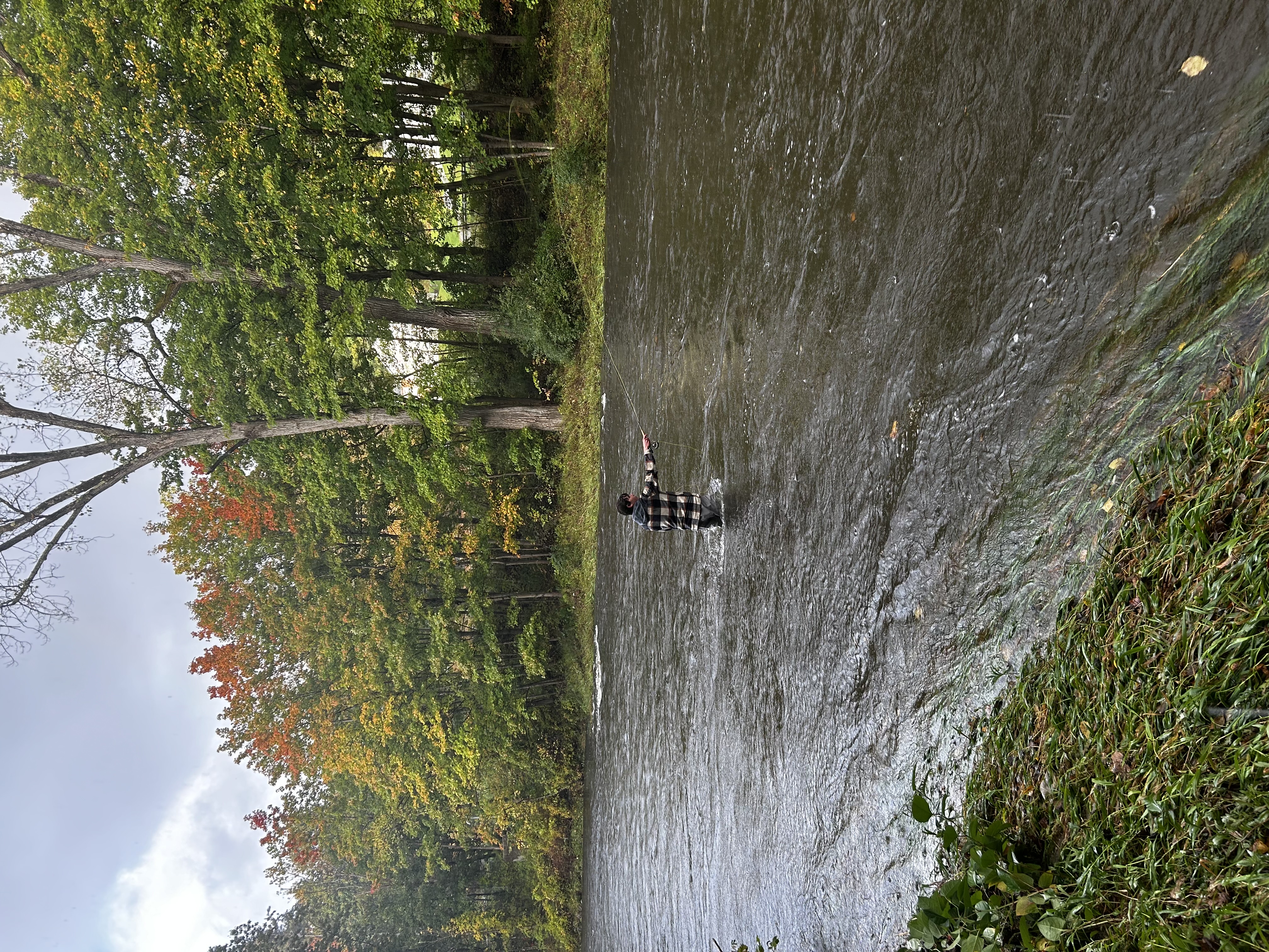 Harris Longfield fishing in a river